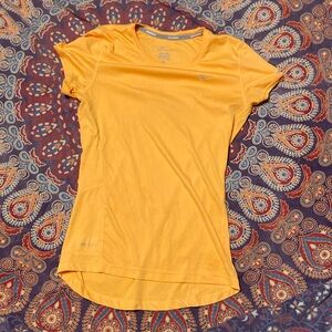 Orange Nike Dri-Fit shirt